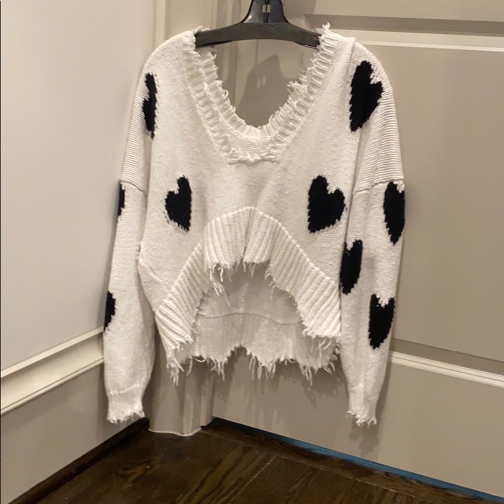 white fox sweater with black hearts